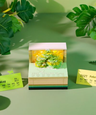 3D art calendar with realistic green tree design in paper cube shape, with LED light and loose leaf function. This desktop decoration is suitable for use as a note-taker and business gift.